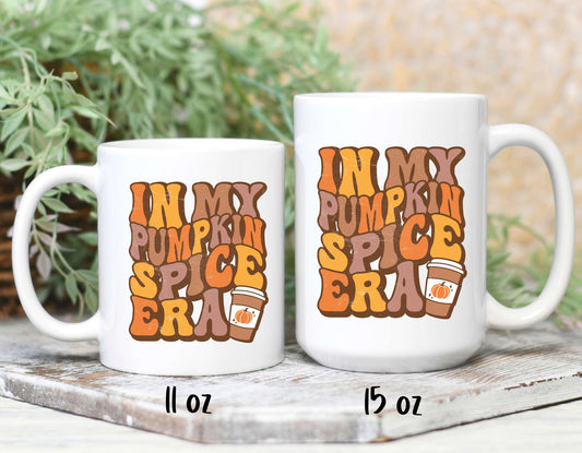 two sizes of in my pumpkin spice era coffee mugs. Text printed on a white mug.